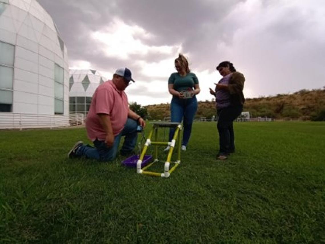 Participants collecting data outside the Biosphere 2 Lower Habitat Rooms with their new agrivoltaics kits.jpg